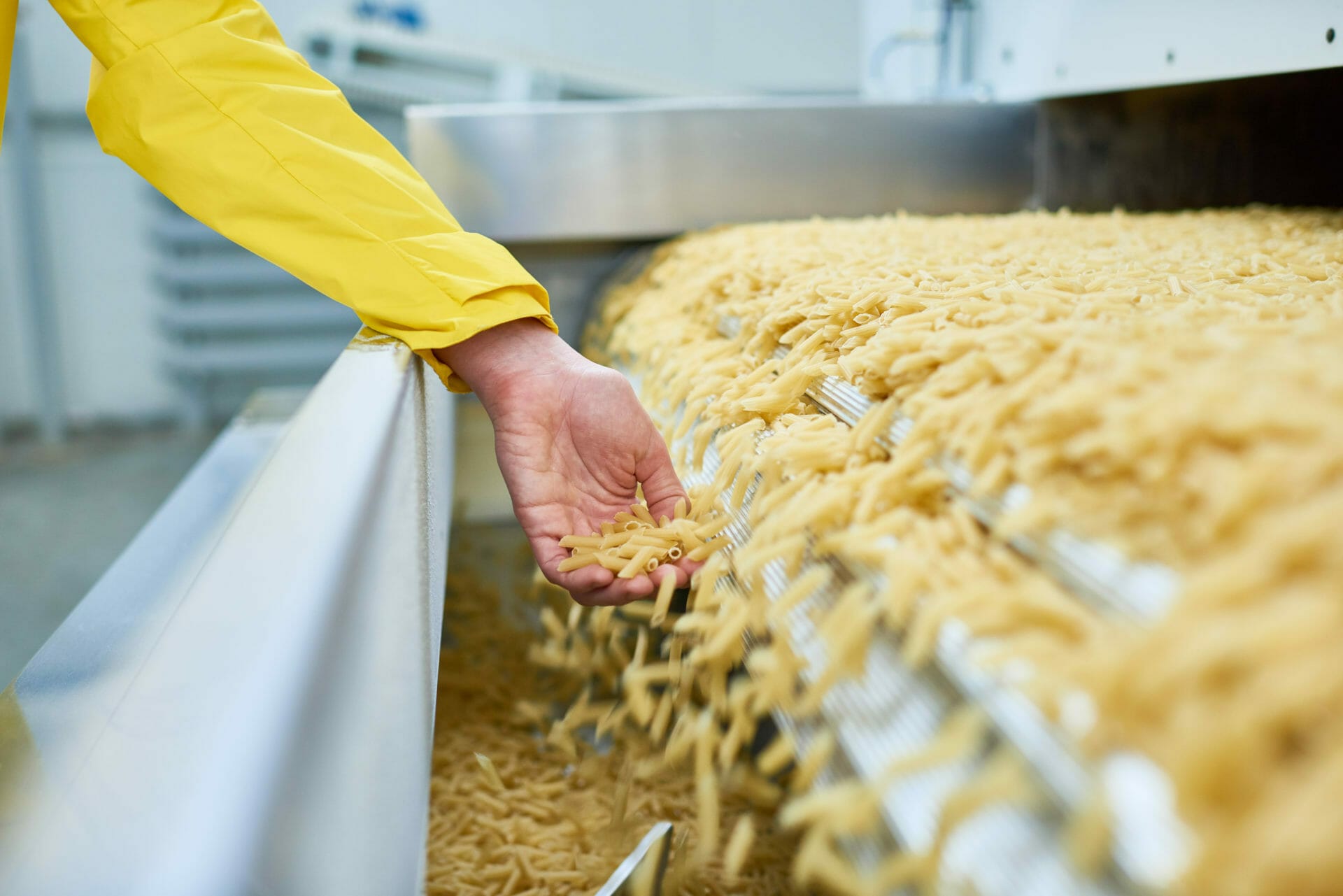 Spilling Macaroni in food processing factory
